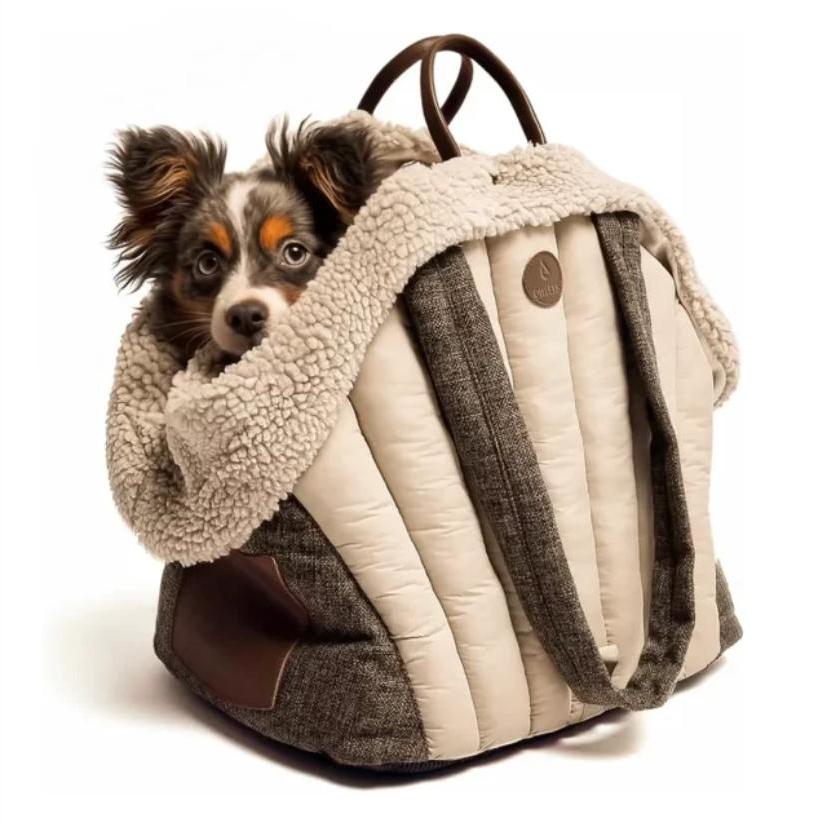 King Woof dog carrier bag with a small dog peeking out of the top