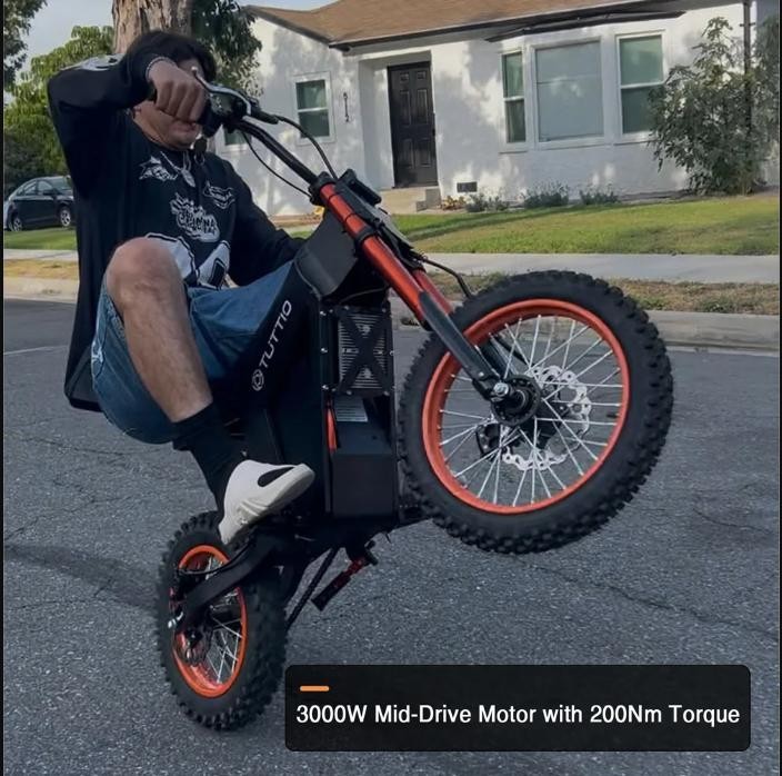 Tuttio Soleil01 Electric Dirt Bike wheelie showing the 3000W mid-drive motor and 200Nm torque
